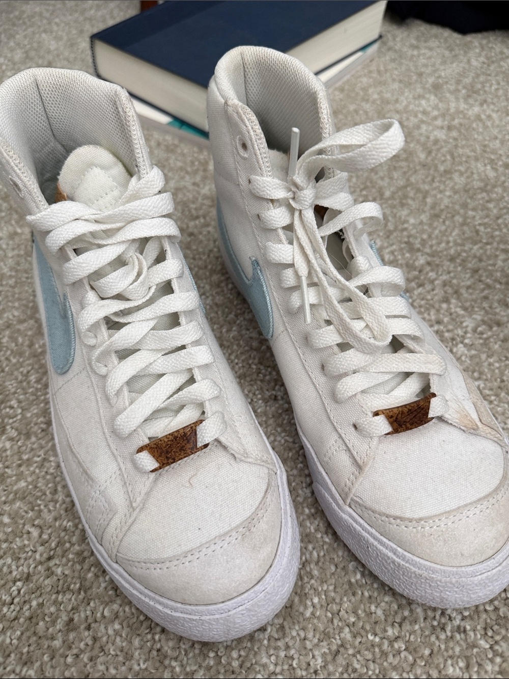 Nike Women's White High-Top Sneakers with Light Blue Swoosh